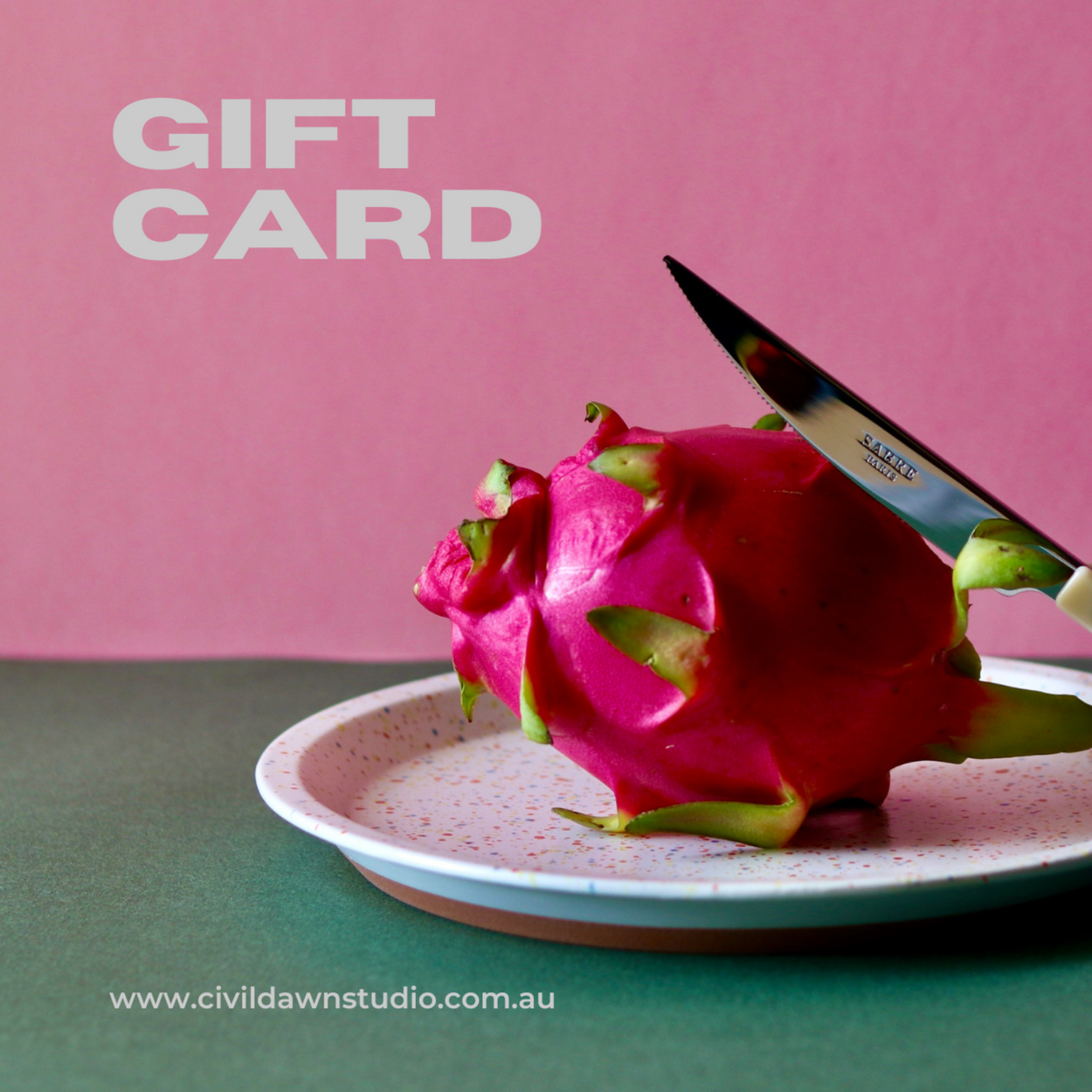 A gift card from Civil Dawn Studio, displayed with a decorative pink food item on a plate, presented against a pink background.