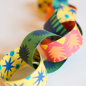 Colorful paper chain on a white background