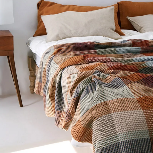 Bedroom with Mungo Vrou-Vrou Cotton Waffle Blanket - Cedarwood on bed