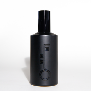 Black perfume bottle with a unique design on a white background