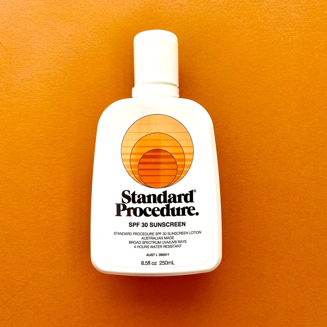 Standard Procedure Sunscreen SPF 30 with orange background