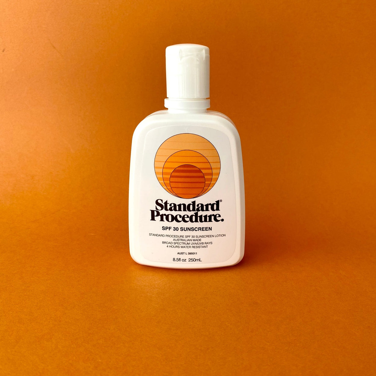 Standard Procedure Sunscreen SPF 30 with orange background