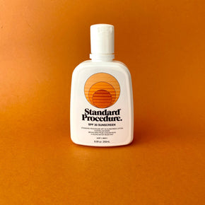 Standard Procedure Sunscreen SPF 30 with orange background