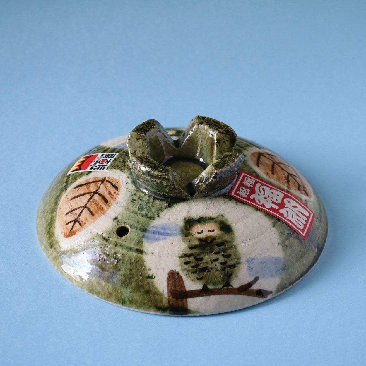 Vintage Japanese owl bowl incense holder with blue background base profile