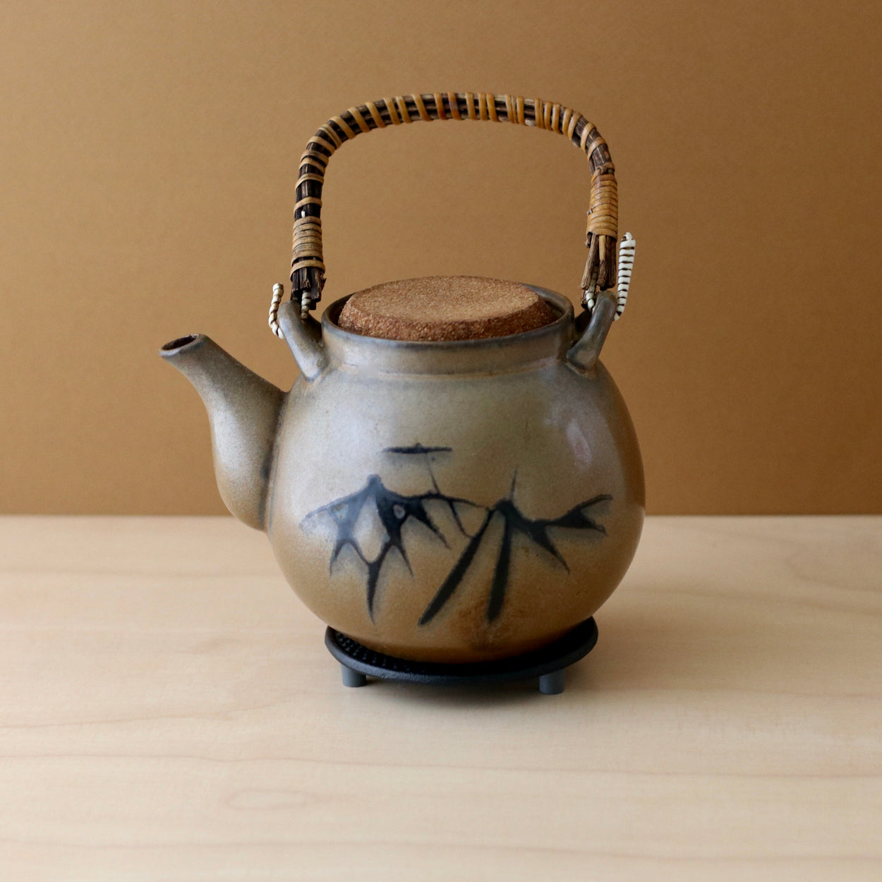 Nambu tetsuki small Japanese iron pot stand with ceramic kettle on top