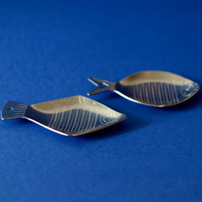 Two Japanese Ginger Graters- Fish - close up with blue background.