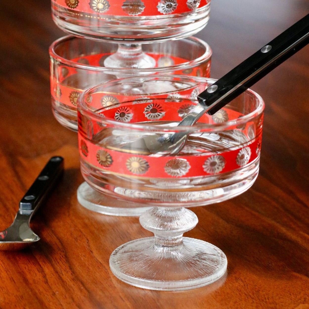 Vintage Set of 6 Glass bistro bowls stacked on wood table with Sabre Spoons.