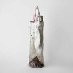 Ceramic vase with speckled design on a white background