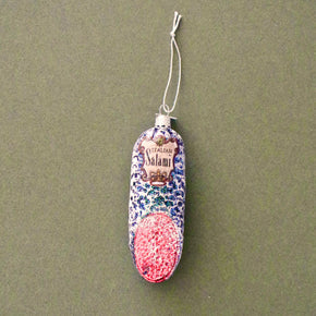 Decorative salami with colorful pattern on a green background