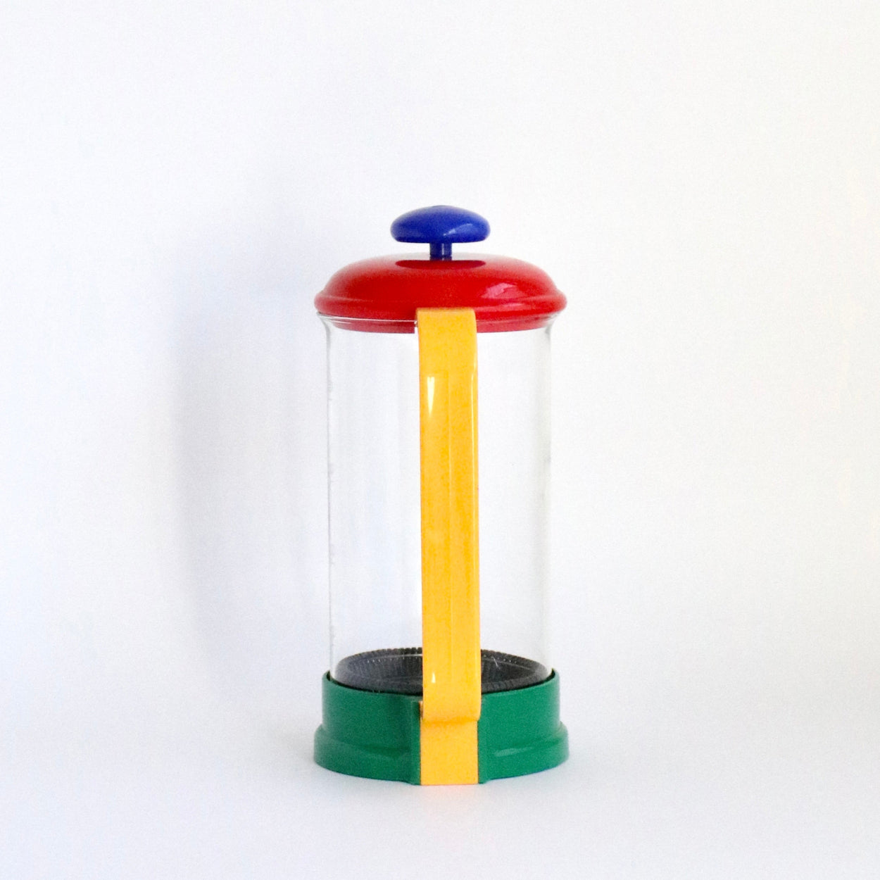 Colourful french press with a yellow handle on a white background