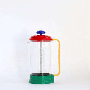 Colorful French press coffee maker on a white background