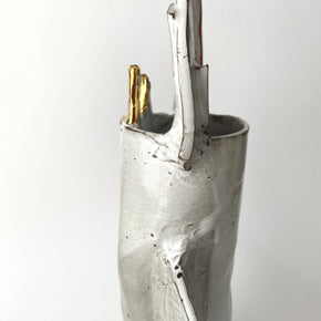 Silver vase with gold accent on a white background