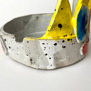 Ceramic bowl with colourful splashes on a white background