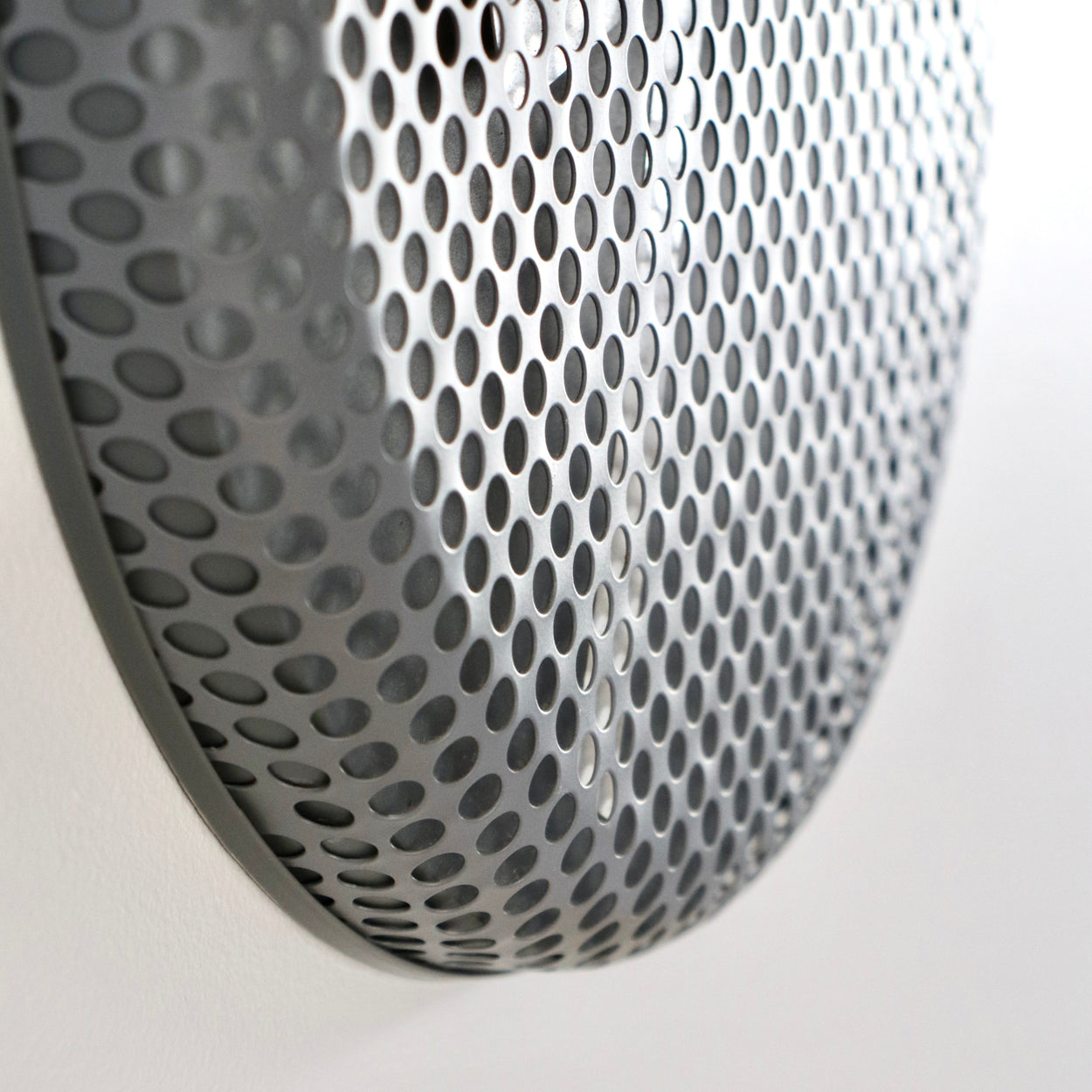 Close-up of a clock metallic pattern on a white background