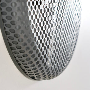 Close-up of a clock metallic pattern on a white background