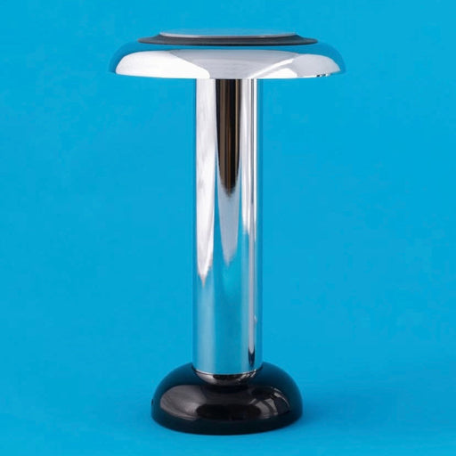 Chrome Sowden Pl6 lamp with a flat top on a blue background