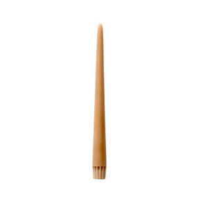 A single taper candle in a warm tan or light brown wax, standing vertically against a plain white background.