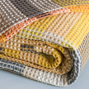 Folded close up of Mungo Vrou-Vrou Cotton Waffle Blanket - Tamarind