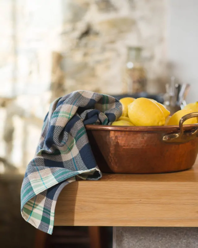 Mungo Vadoek Tea Towel in Cobalt with copper pot and lemons.