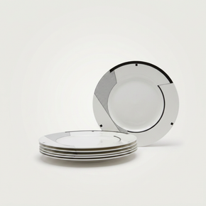Set of white plates with black rim on a white background