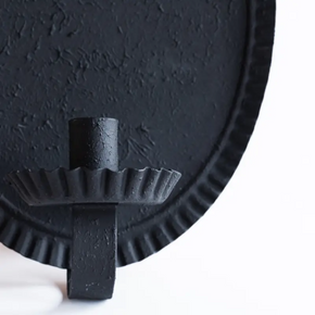 Close up of Oval candle sconce against grey background