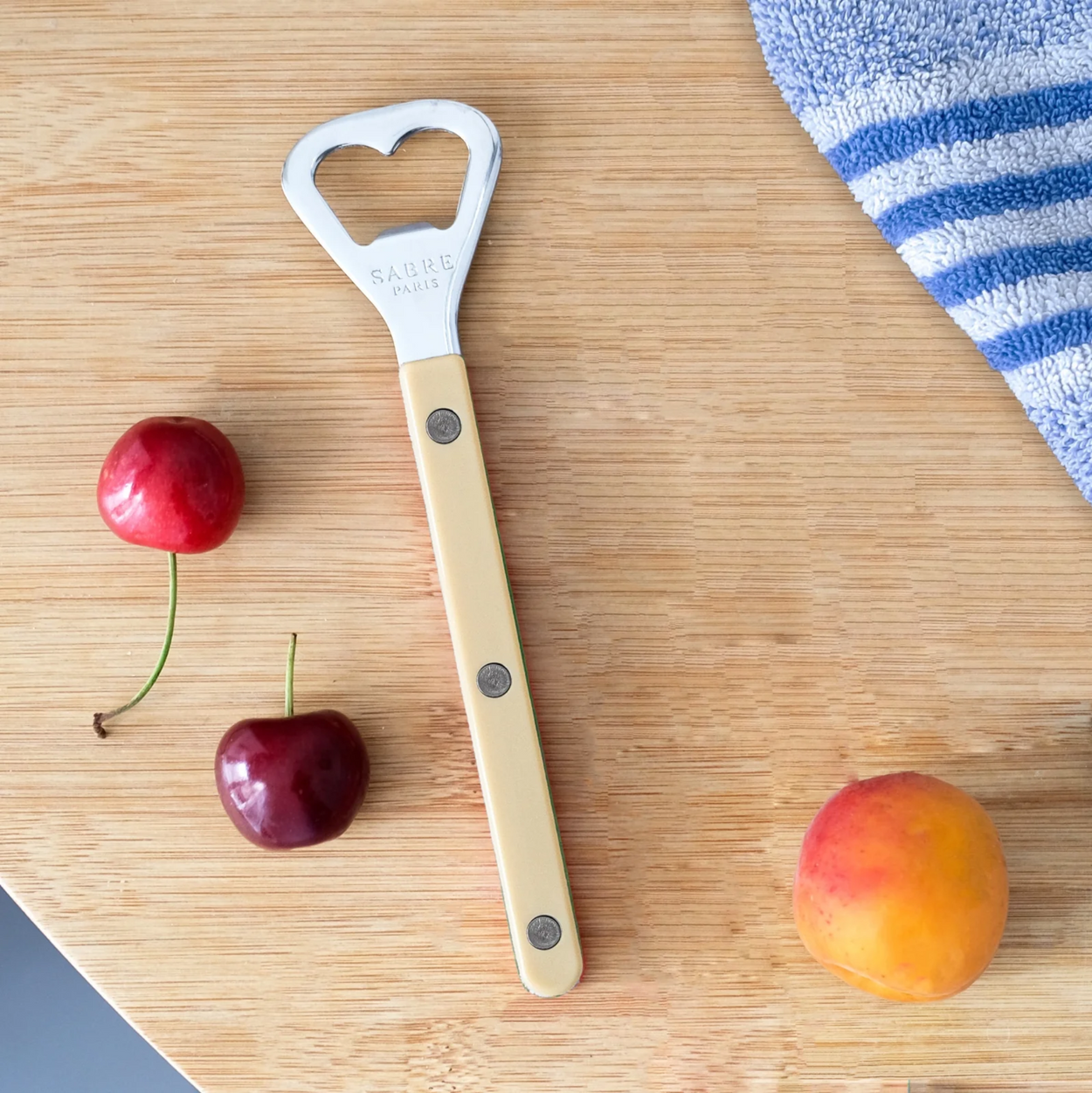 Sabre Paris bottle opener on wooden table