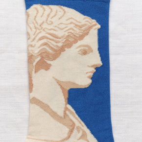 Close up of Statue Bonne Maison socks on white backdrop.