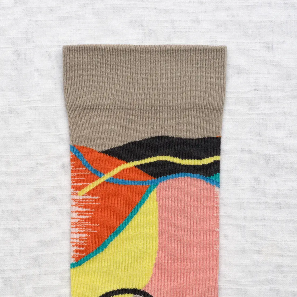 lose up of Bonne Maison Patchwork socks against a white backdrop.