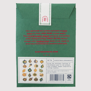 Back of a green card with text and a barcode on a white background