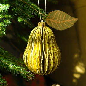 Decorative ornament hanging on a Christmas tree with a blurred background