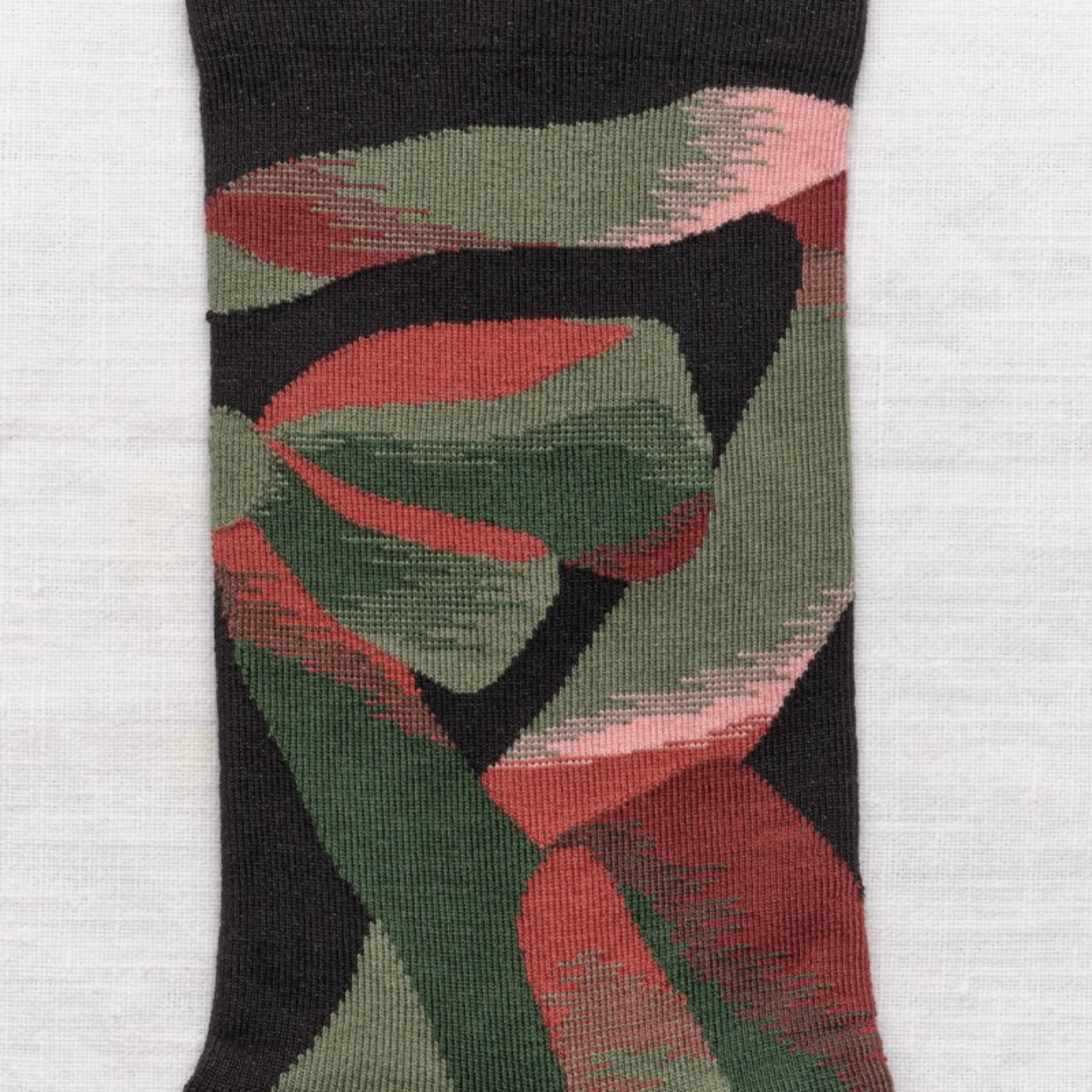 Close up of Bonne Maison Ribbon socks on white backdrop.