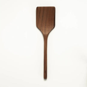 Wooden spatula on a white background