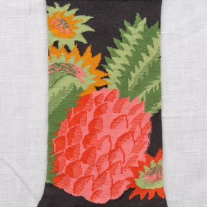 Close up of Bonne Maison Pineapple socks against a white backdrop.