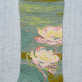 Close up of Waterlily Bonne Maison socks on white backdrop.