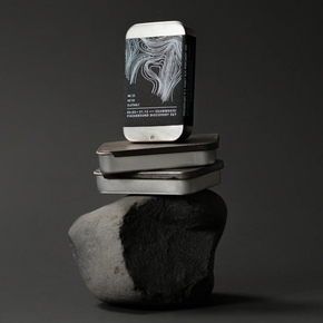 Fischersund Dark Discovery Set case on a reflective surface against a dark background
