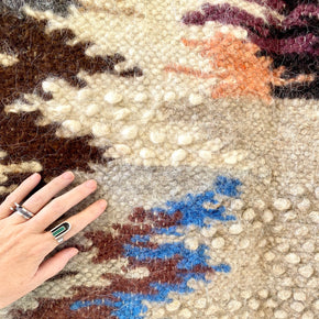Hand Woven Pure Wool Rug - Blue close up with hand for scale
