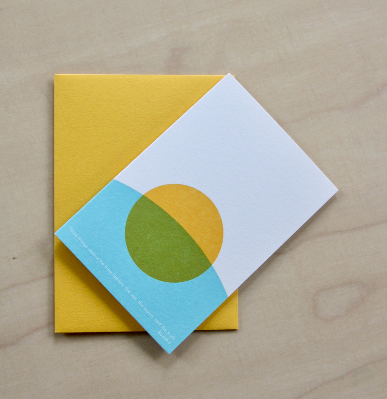 Hand printed greeting card with yellow sun and blue curve on a yellow envelope. reading "Three things cannot be long hidden, the sun, the moon and the truth" Buddha