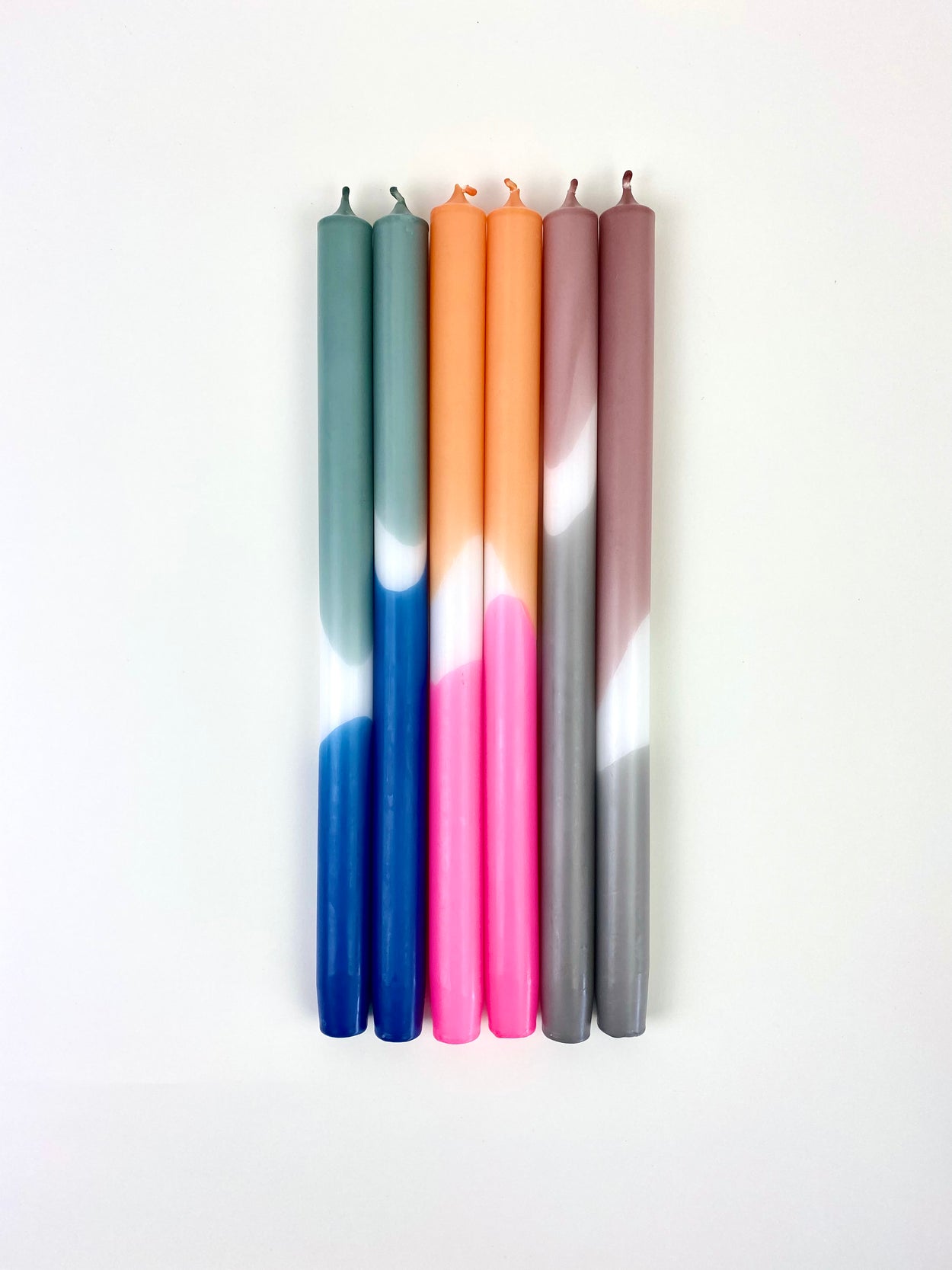 Hand Dipped Dinner Candles - Pink and Orange, Maroon and Blue with white background.
