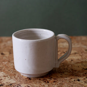 Handmade Ceramic Coffee Mug - Large by Richard Beauchamp, on cork background.