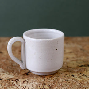 Handmade Ceramic Coffee Mug - Large by Richard Beauchamp on cork background.