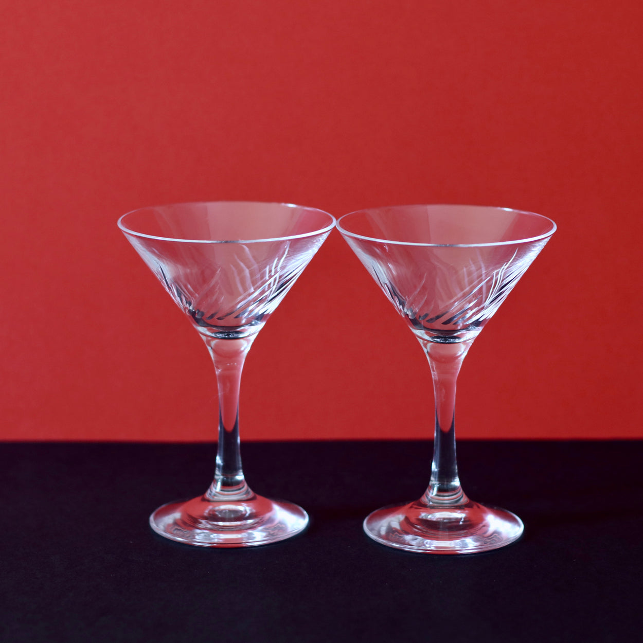 Japanese martini glasses x 2, against red and black backdrop