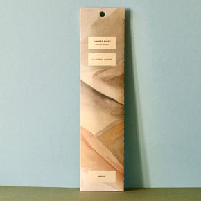 Front packet of Juniper Ridge Campfire Incense - California Juniper against a blue and green background.