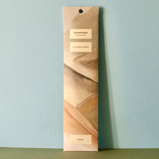 Front packet of Juniper Ridge Campfire Incense - California Juniper against a blue and green background.