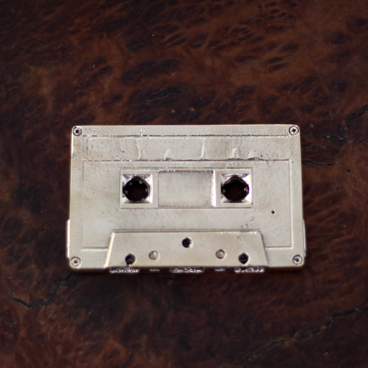 Bronze Cassette Mix Tape by Nancy Pearce on burl bench