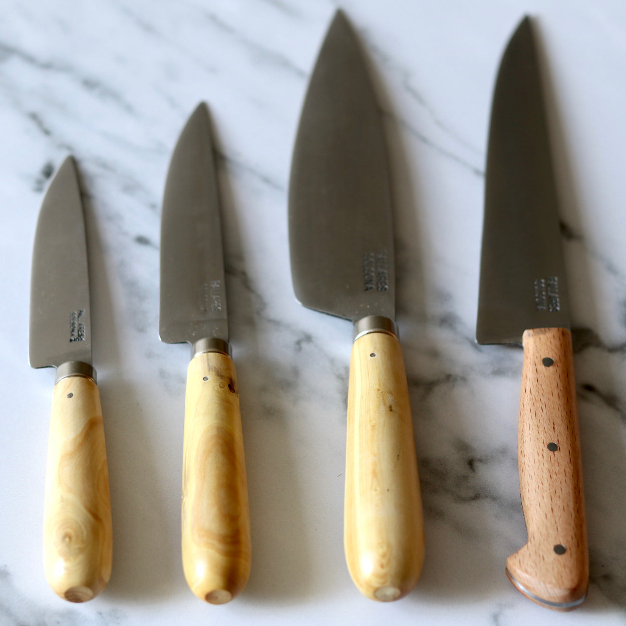 A group of 4 Pallares Solsona Box Wood Carbon Steel Kitchen Knives