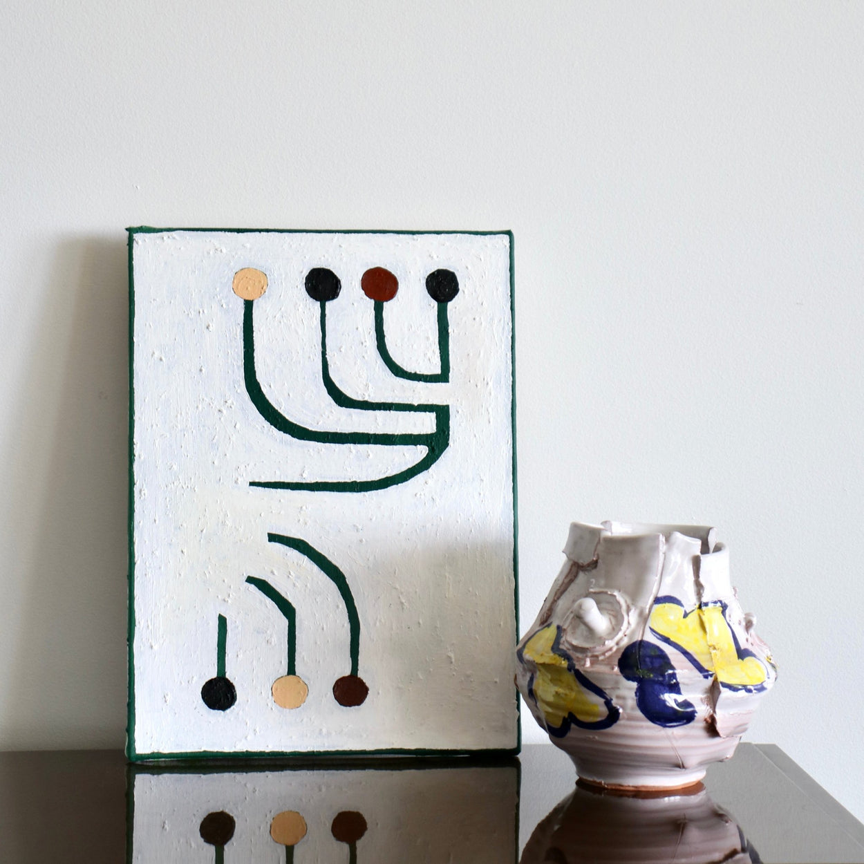 Modern Ceramic Vase by Elin Hughes next to modern abstract painting