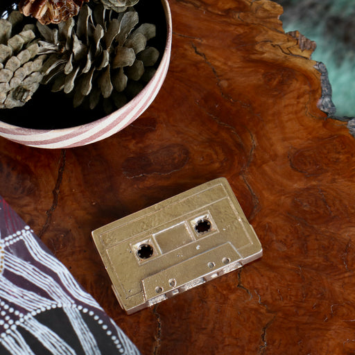 Bronze Cassette Mix Tape by Nancy Pearce on angle on burl bench