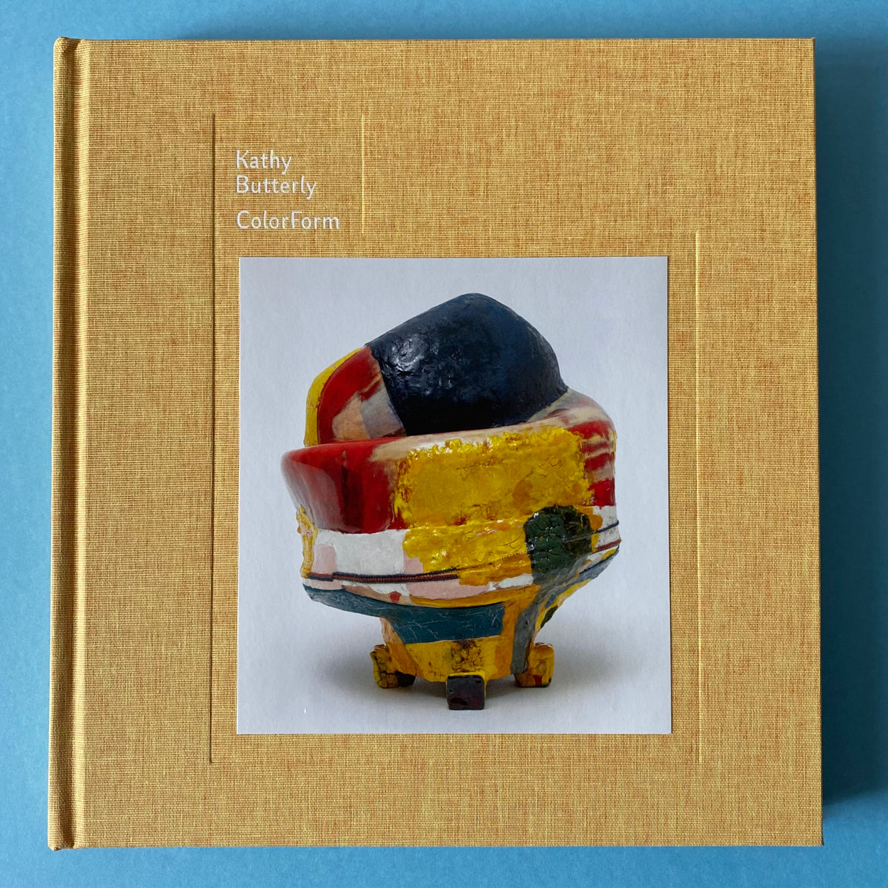 Kathy Butterly: Colorform Hard Cover Book against a pale blue background