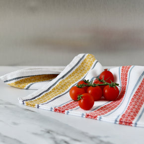 Pure cotton Portuguese tea towel with cherry tomatoes on marble bench