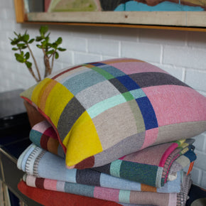 Premium Merino wool cushion cover in Lloyd with blankets on buffet top.